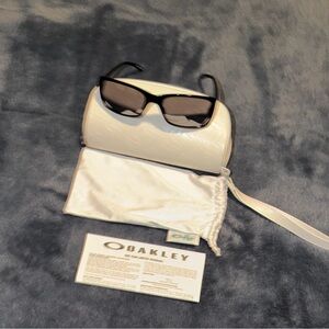 Oakley Black Polarized Sunglasses with Mirrored Lenses, White Case and Pouch